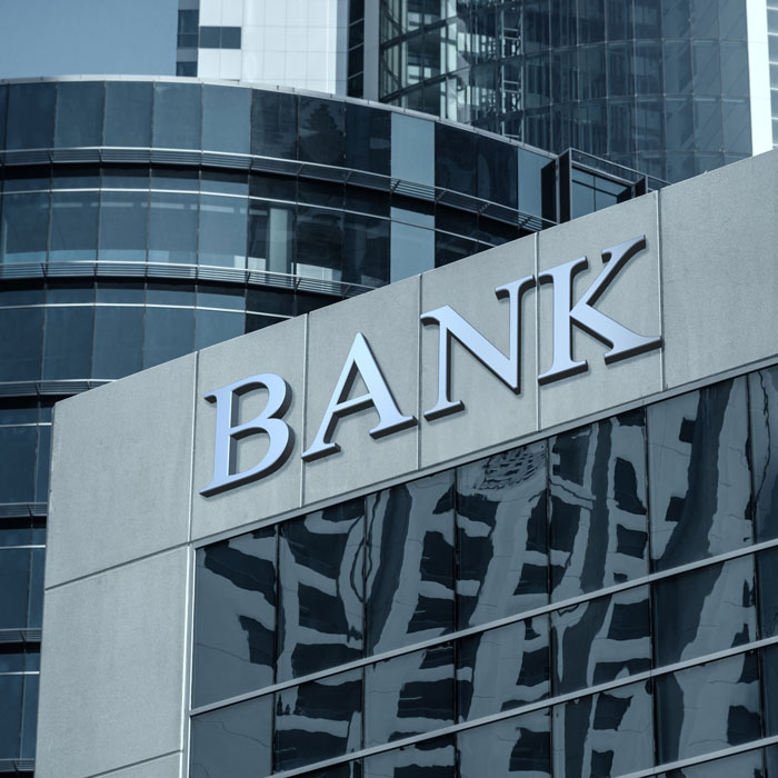 Bank sign on glass wall of business center