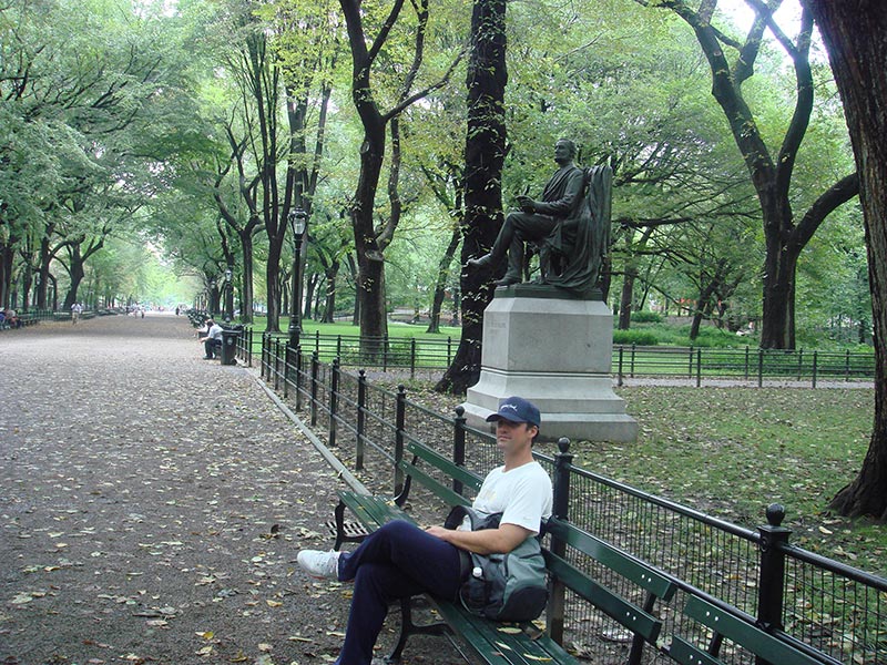 Tom sitting on park bench