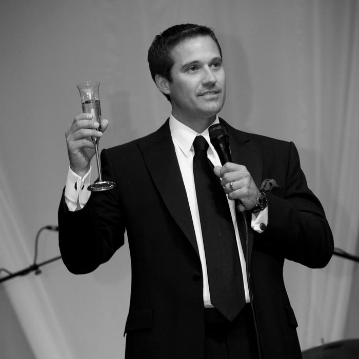 tom toasting with champagne glass